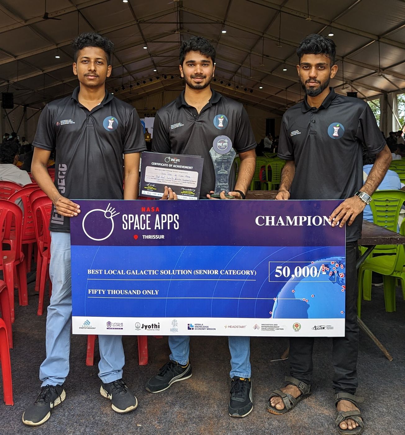 NASA Space Apps champions holding the winners cheque